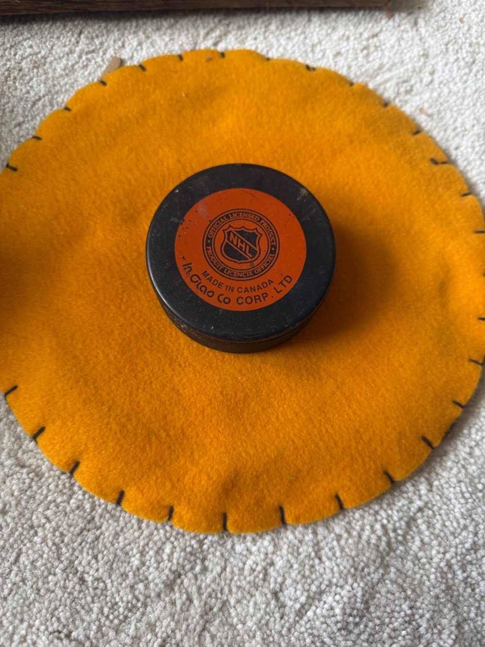 NHL Black Hockey Puck with Orange Center Logo